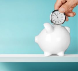 pocket watching being deposited into piggy bank